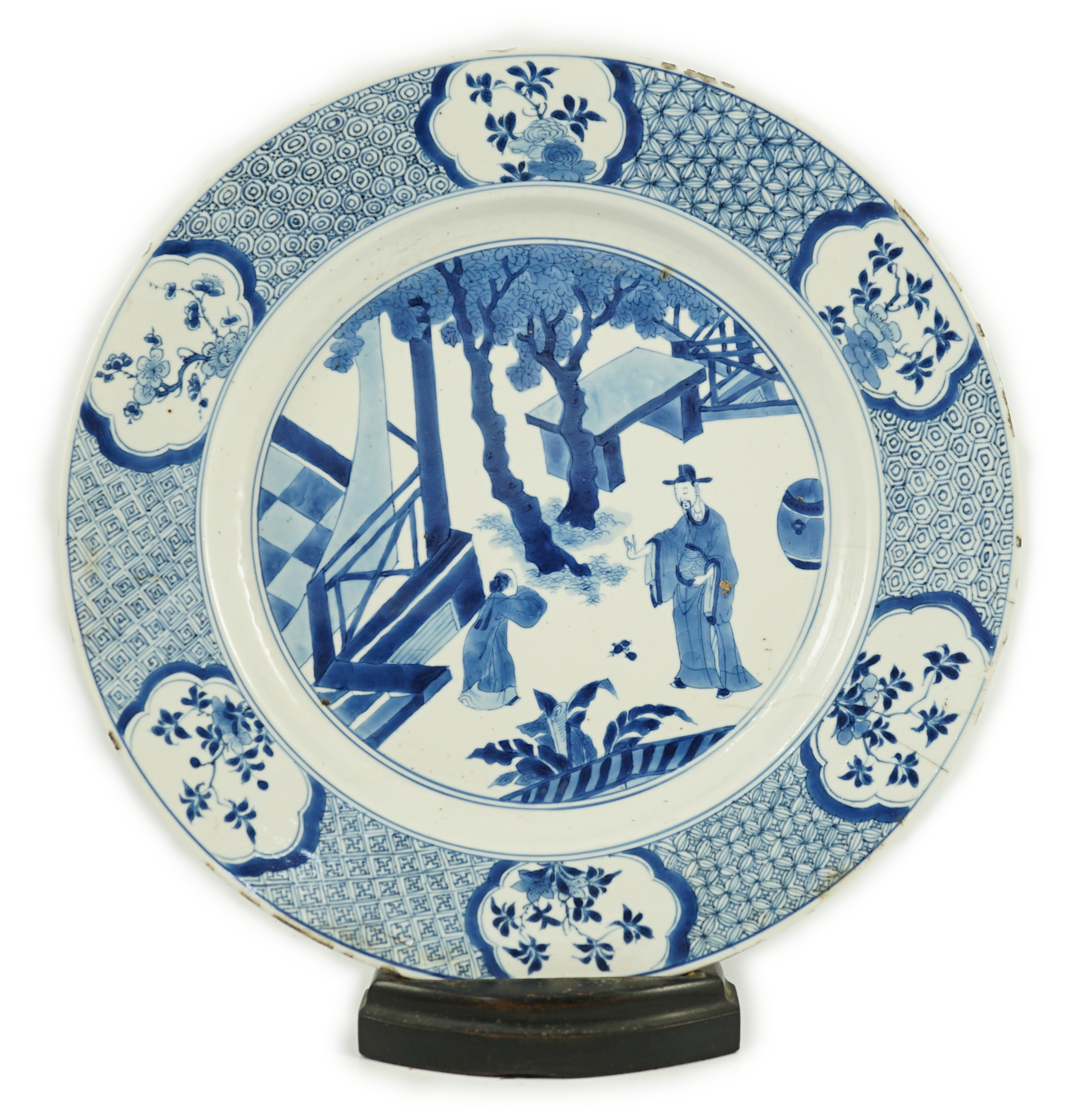 A Chinese blue and white ‘court scene’ dish, Kangxi period, two rim cracks and small splinter chips